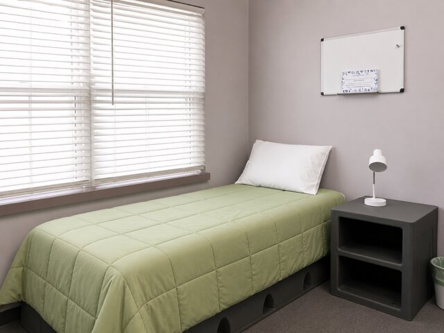 Green-themed bedroom for a resident