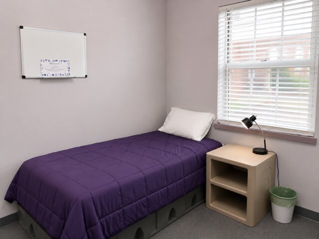 Purple-themed bedroom for a resident